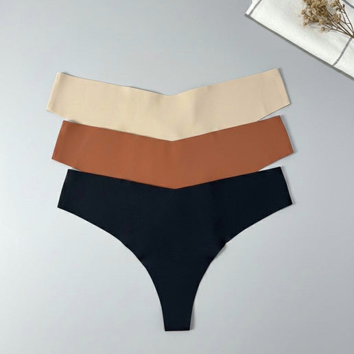 Three pairs of underwear in beige, brown, and black on a light gray background.