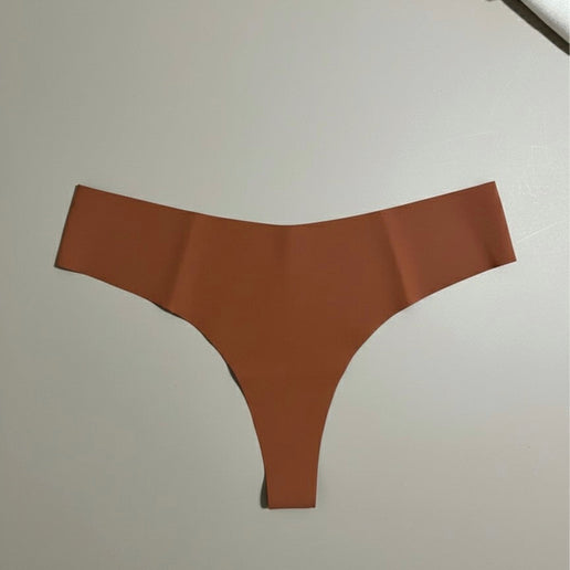 Brown thong on a light gray background