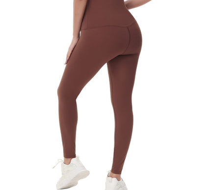Pregnant Brown leggings worn by a person on a white background